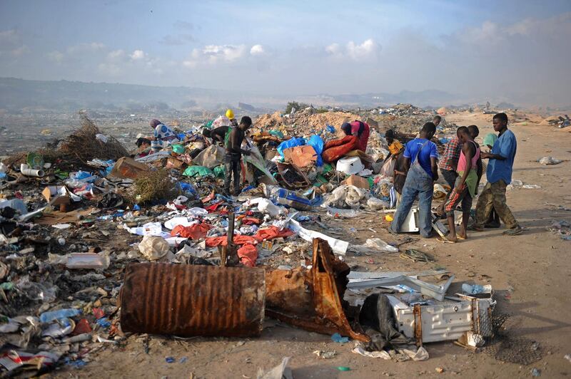 People scavenging at the Wadajir municipal dumping site in Mogadishu, Somalia.  The United Nations celebrate on June 5 the World Environmental Day dedicated this year to the theme "Beat Plastic Pollution". Mohamed Abdiwahab / AFP