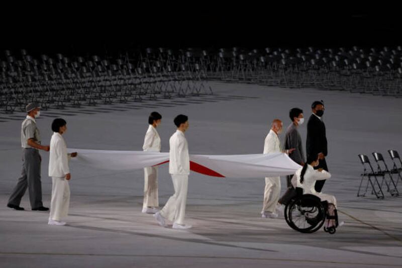 The Japanese national flag is carried into the stadium during the opening ceremony of the Tokyo 2020 Paralympic Games. Getty