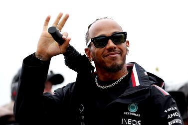 ZANDVOORT, NETHERLANDS - AUGUST 27: Lewis Hamilton of Great Britain and Mercedes waves to the crowd on the drivers parade prior to the F1 Grand Prix of The Netherlands at Circuit Zandvoort on August 27, 2023 in Zandvoort, Netherlands. (Photo by Lars Baron / Getty Images)