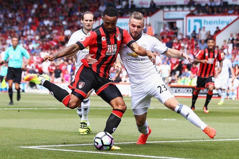 Luke Shaw of Manchester United challenges Callum Wilson of AFC Bournemouth during the Premier League match between AFC Bournemouth and Manchester United at Vitality Stadium on August 14, 2016 in Bournemouth, England. Michael Steele / Getty Images