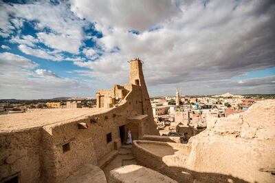 This picture shows a view of the recently restored fortress of Shali and its surroundings, in the Egyptian desert oasis of Siwa, some 600 kms southwest of the capital Cairo, on November 6, 2020.  The 13th century edifice, called Shali or "Home" in the Siwi language, was built by Berber populations, using kershef, a mixture of clay, salt and rock which acts as a natural insulator in an area where the summer heat can be scorching.
After it was worn away by erosion, and then torrential rains in 1926, the European Union and Egyptian company Environmental Quality International (EQI) from 2018 sought to restore the building, at a cost of over $600,000.
 / AFP / Khaled DESOUKI
