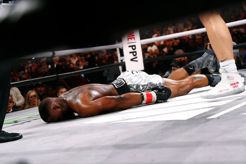 Tyron Woodley lays on the ground after being knocked out by Jake Pau. USA Today