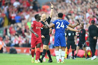 Reece James is shown a red card after handling the ball on the goalline. Getty