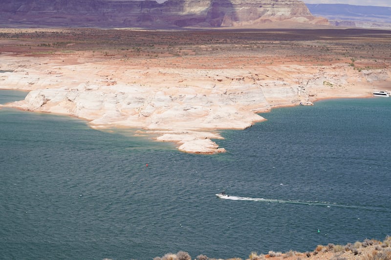 A ring of white shows where the water level once reached on Lake Powell.