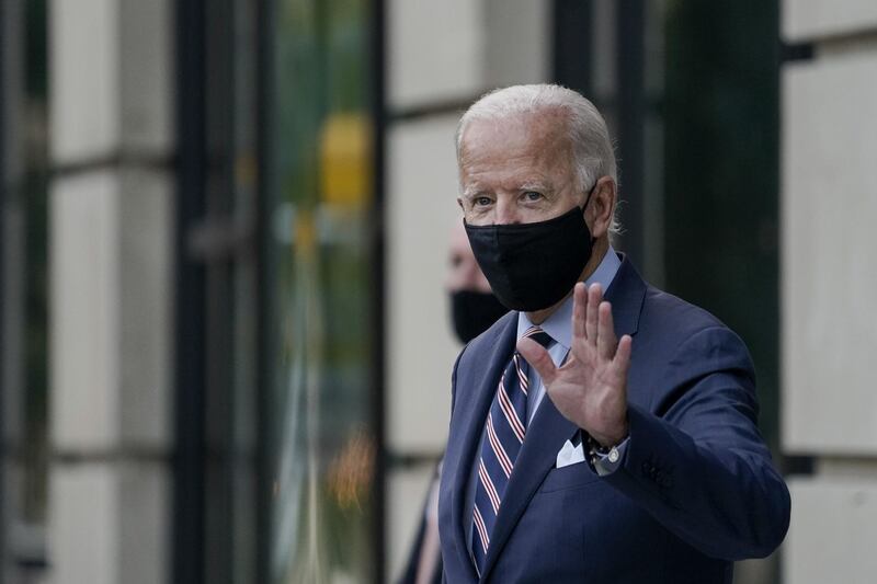 WILMINGTON, DE - SEPTEMBER 16: Democratic presidential nominee and former Vice President Joe Biden waves as he leaves the Hotel Dupont after having internal campaign meetings on September 16, 2020 in Wilmington, Delaware. Earlier in the day, Biden participated in a briefing with medical professionals about the coronavirus vaccine.   Drew Angerer/Getty Images/AFP
== FOR NEWSPAPERS, INTERNET, TELCOS & TELEVISION USE ONLY ==
