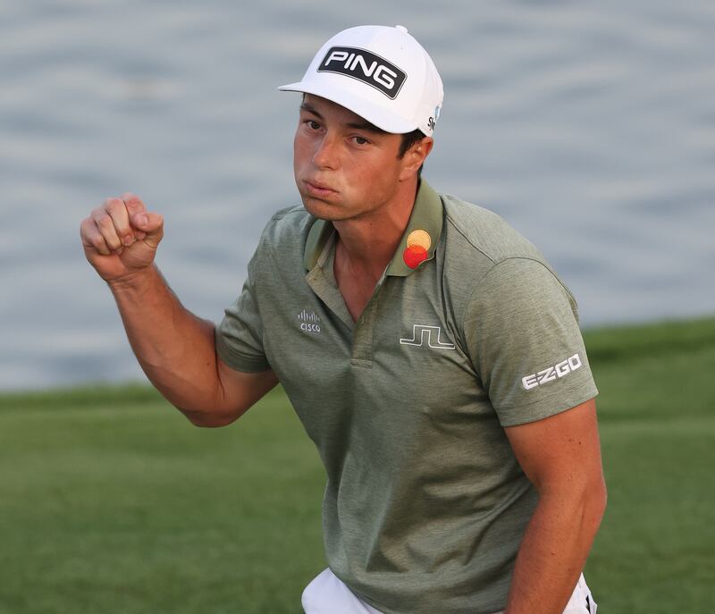 Viktor Hovland celebrates after beating Richard Bland in a play-off to win the Slync.io Dubai Desert Classic. Getty