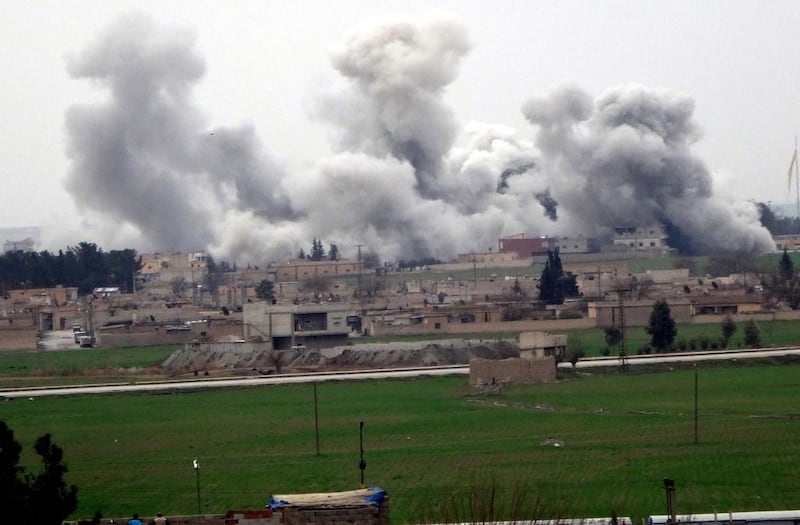 Smoke rises from the Syrian city of Tel Abyad during clashes between ISIL and YPG. AFP