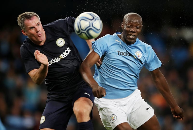Manchester City Legends' Benjani in action with Premier League All-Stars' Jamie Carragher. Reuters