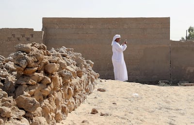 RAS AL KHAIMAH , UNITED ARAB EMIRATES , FEB 21  – 2018 : Student from Saeed Bin Jubair Secondary School taking photographs with his smart phone during the photography workshop at Al Jazirah Alhamra old town in Ras Al Khaimah. ( Pawan Singh / The National ) For News. Story by Ruba Haza