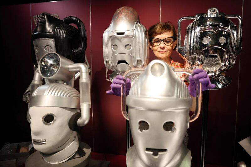 Sculpture conservator Marisa Prandelli adjusts a display of heads of 'Cybermen' in the monster vault at the ‘Doctor Who: Worlds of Wonder’ exhibition on Thursday. The exhibition opens at the World Museum later this month in Liverpool. Reuters