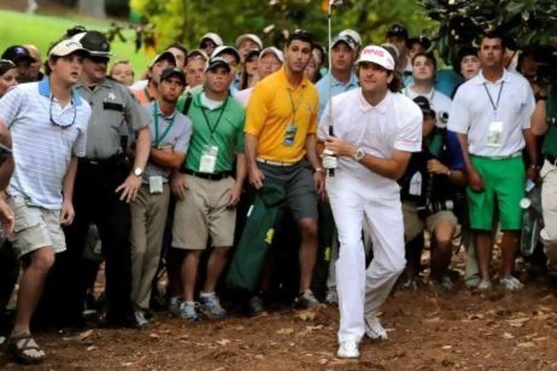 Bubba Watson takes his 'crazy' shot on the 10th during the play-off against Louis Oosthuizen. Timothy A Clary / AFP