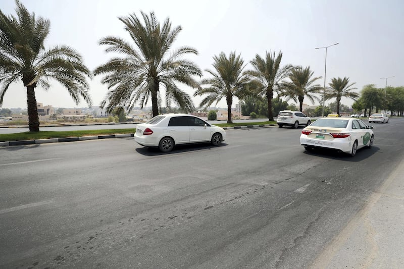 Ras Al Khaimah, United Arab Emirates - September 13, 2018: Plans to upgrade Ras Al Khaimah road network is underway aiming to reduce accidents by repainting old road lanes and speed bumps. Faded road lines on clock roundabout, Sheikh Mohammed bin Salem road and Khuzam road. Thursday, September 13th, 2018 at Clock roundabout, Ras Al Khaimah. Chris Whiteoak / The National