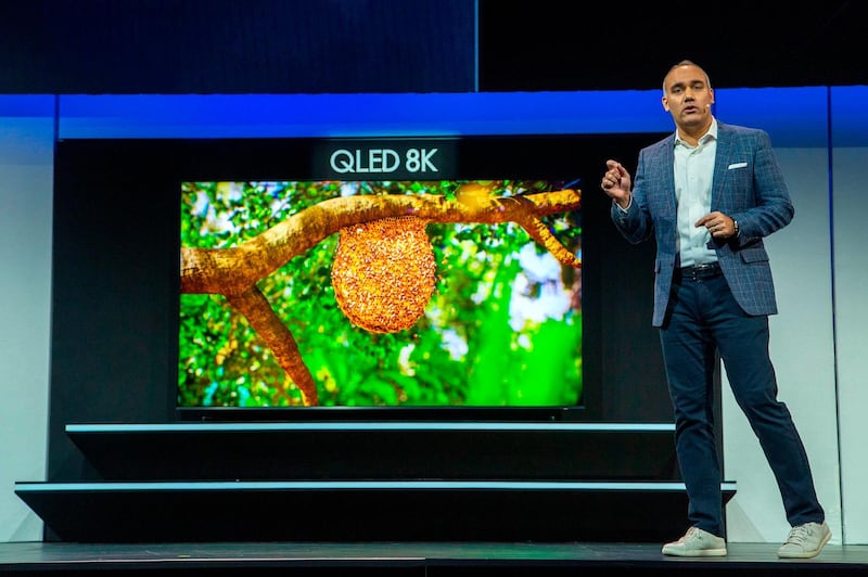 Senior Vice President of Samsung Electronics America Dave Das showcases the QLED 8K television at the Samsung press conference at the Mandalay Bay Convention Center during CES 2019 in Las Vegas on January 7, 2019. / AFP / DAVID MCNEW
