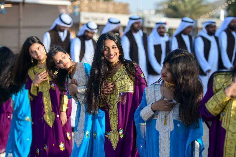 A group of girls perform the Ayyala dance to send off sailors heading out to sea