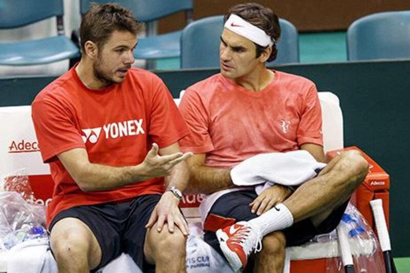 Stanislas Wawrinka, left, became the top-ranked Swiss tennis player in the world by overtaking Roger Federer. Salvatore di Nolfi / EPA