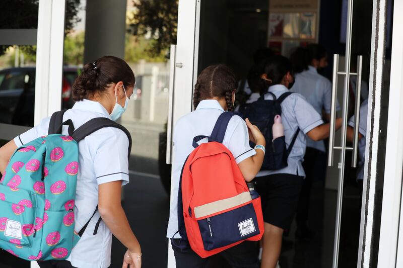 Children arrive for the first day of school after the summer holidays at Dubai British School Jumeirah Park. Chris Whiteoak / The National