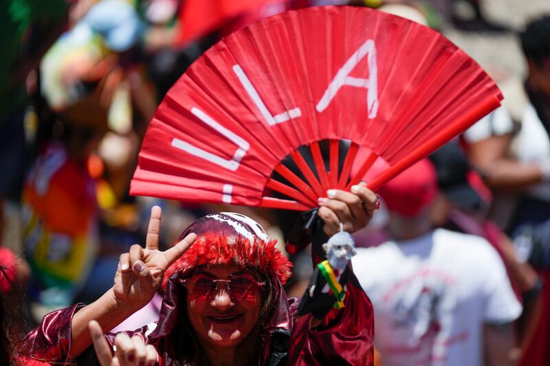 A supporter of Luiz Inacio Lula da Silva flashes a victory sign in Brazil prior to his inauguration. AP