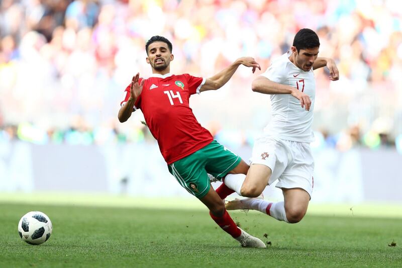 MOSCOW, RUSSIA - JUNE 20:  Goncalo Guedes of Portugal is challenged by Mbark Boussoufa of Morocco during the 2018 FIFA World Cup Russia group B match between Portugal and Morocco at Luzhniki Stadium on June 20, 2018 in Moscow, Russia.  (Photo by Dean Mouhtaropoulos/Getty Images)