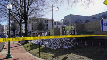 Yellow caution tape blocks off the area around the Israeli Embassy’s after a man set himself on fire in front of the mission on Sunday. Willy Lowry / The National