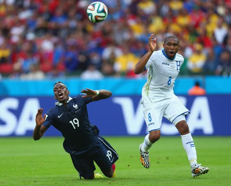 Wilson Palacios of Honduras fouls Paul Pogba of France resulting in a penalty kick during their match at the 2014 World Cup on Sunday. Jeff Gross / Getty Images