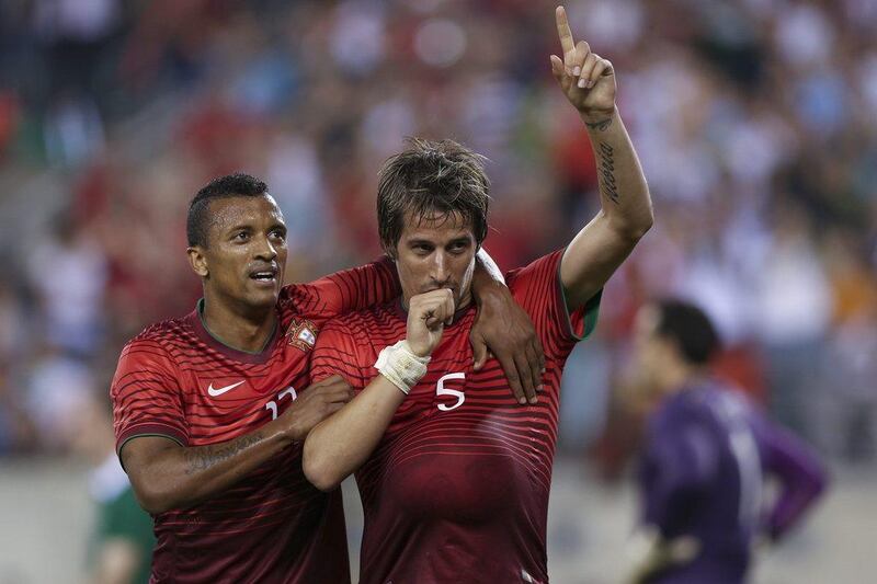 Portugal's Fabio Coentrao, right, and teammate Nani, left, celebrate a goal against Ireland in their World Cup warmup friendly on Tuesday. Jose Sena Goulao / EPA / June 10, 2014