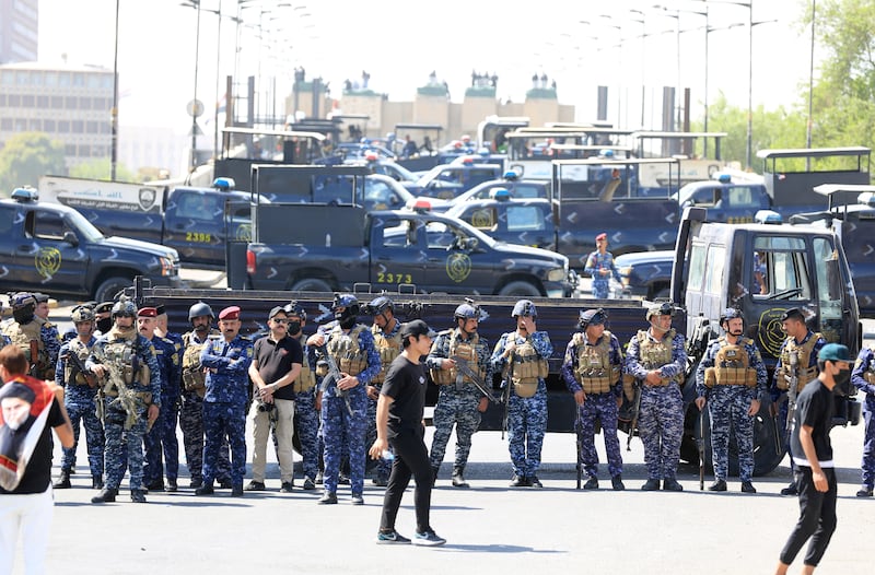 Security forces block a road during demonstrations in Baghdad's Tahrir Square as anti-government protesters try to enter the Iraqi capital's fortified Green Zone. EPA