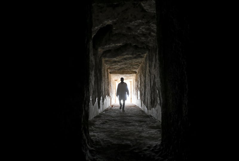 An Egyptian archaeologist walks inside one of the largest newly discovered pharaonic tombs 'Shedsu Djehuty' in Luxor, Egypt. Reuters