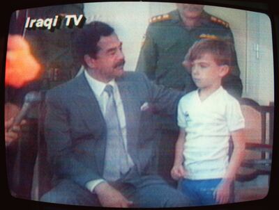 Saddam Hussein with Stewart Lockwood, a passenger on BA149. AFP