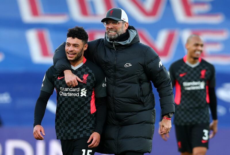 Soccer Football - Premier League - Crystal Palace v Liverpool - Selhurst Park, London, Britain - December 19, 2020 Liverpool manager Juergen Klopp and Liverpool's Alex Oxlade-Chamberlain celebrate after the match Pool via REUTERS/Clive Rose EDITORIAL USE ONLY. No use with unauthorized audio, video, data, fixture lists, club/league logos or 'live' services. Online in-match use limited to 75 images, no video emulation. No use in betting, games or single club /league/player publications.  Please contact your account representative for further details.