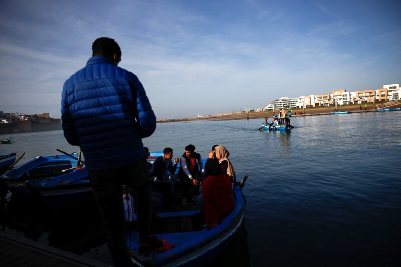 People wait on board a wooden boat to cross Bou Regreg river in Rabat, Morocco, December 19, 2022.  REUTERS / Juan Medina
