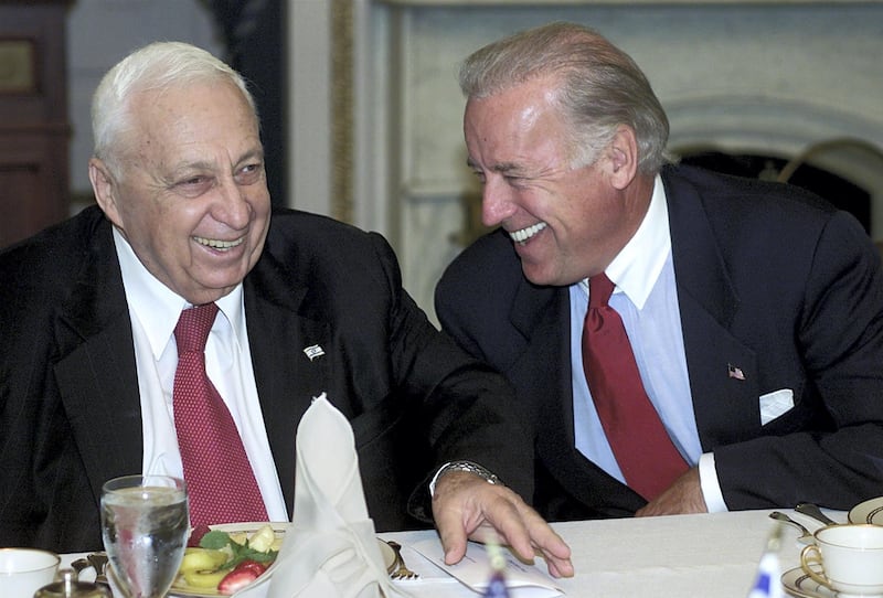 Israel's Prime Minister Ariel Sharon (L) laughs with Chairman of the Senate Foreign Relations Senator Joe Biden (R) during a meeting at the US Capitol 11 June 2002. Sharon is visiting Capitol Hill to thank members of both houses of Congress for their support for Israel and his policies.
   AFP Photo/Stephen JAFFE (Photo by STEPHEN JAFFE / AFP)