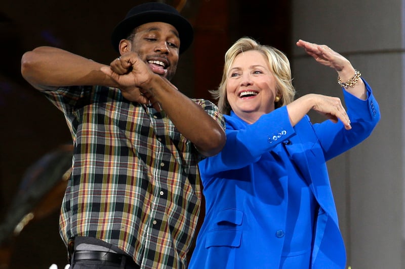 Hillary Clinton practices her dance moves with Boss during a break in the taping of The Ellen DeGeneres Show. AP 