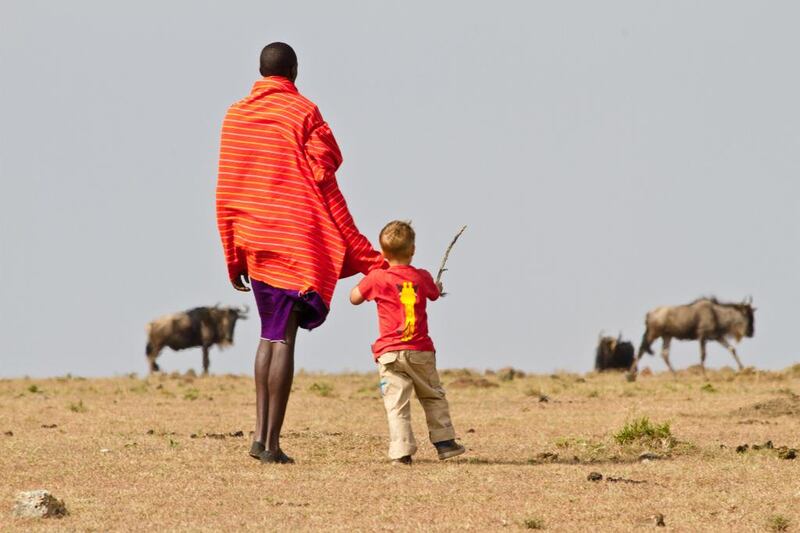 Jake Stuart watching some wild beasts in Masai Mara. Photo by Stuart Butler