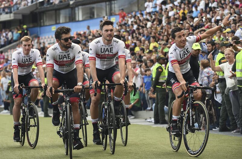 Colombian cyclists Sergio Henao (R) and Fernando Gaviria from UAE Team Emirates greet the crowd during the presentation of the Tour Colombia 2.1, at the Atanasio Girardot stadium in Medellin, Antioquia Department, on February 10, 2019. The Tour Colombia 2.1 cycling race will take place between the 12th and 17th of February. / AFP / JOAQUIN SARMIENTO
