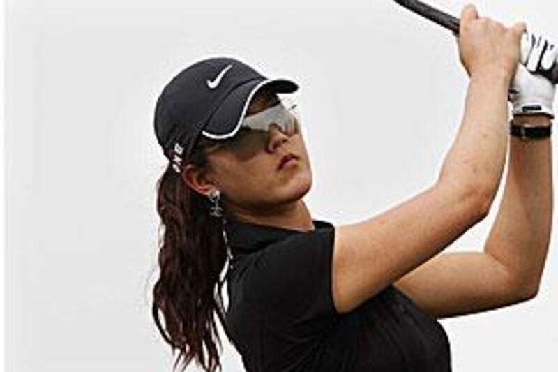 Michelle Wie  completes a swing during a pro-am event at the Emirates Golf Club in Dubai yesterday.