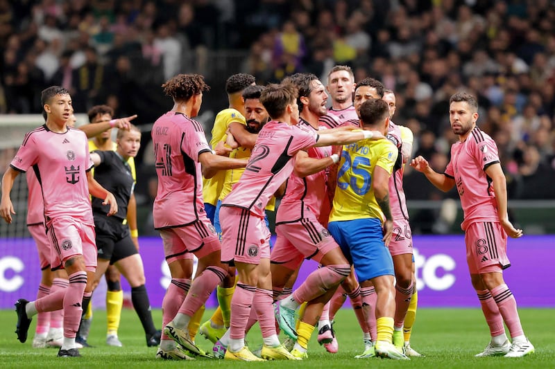 Players intervene in an argument between Inter Miami's Spanish defender Jordi Alba and Al Nassr's Portuguese midfielder Otavio. AFP
