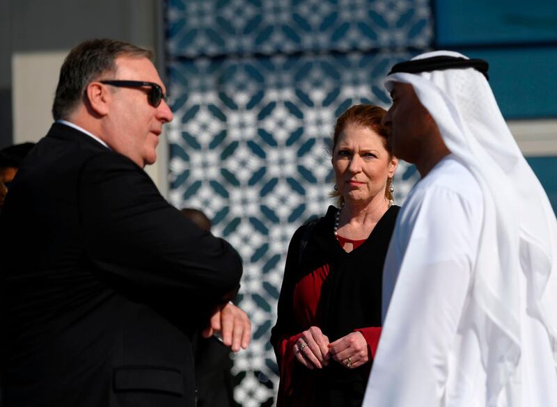 US Secretary of State Mike Pompeo (L) and his wife Susan (C) speak with the Emirati Ambassador to the US Yousef Al Otaiba at the NYU Abu Dhabi campus in Abu Dhabi on January 13, 2019.  / AFP / POOL / ANDREW CABALLERO-REYNOLDS

