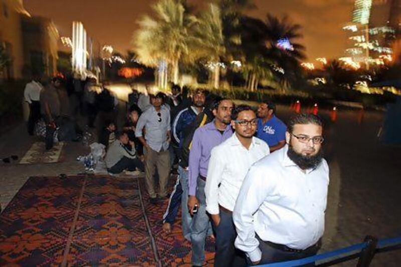 A crowd queue outside a Nakheel office in Dubai as Jumeirah Village Circle villas go on sale last week. Sarah Dea / The National