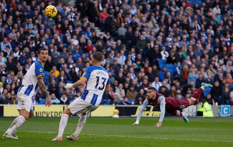 Aston Villa's Emiliano Buendia hits the post with a diving header. Reuters