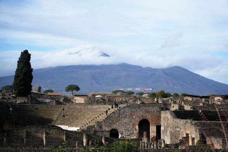 The Mount Vesuvius volcano towers over the remains of the ancient town of Pompeii.