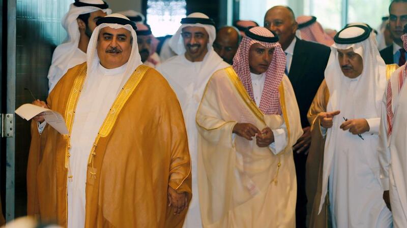 Bahraini foreign minister Sheikh Khalid bin Ahmed Al Khalifa, left, walks in to a press conference as Saudi foreign minister Adel bin Ahmed Al Jubeir, Egyptian foreign minister Sameh Shoukri and Sheikh Abdullah bin Zayed after their talks on their dispute with Qatar, in Manama. Hamad I Mohammed / Reuters