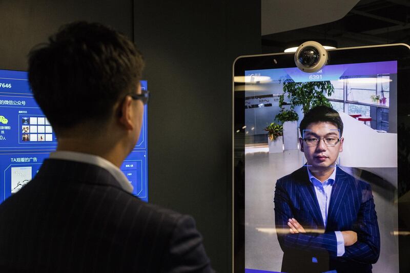 Xu Li, chief executive officer of SenseTime Group Ltd., is identified by the company's facial recognition system on a screen as he poses for a photograph at SenseTime's showroom in Beijing, China, on Friday, June 15, 2018. SenseTime's image-identifying algorithms have made it the world's most valuable AI startup and an early leader in China, where it's won contracts with the country's top phonemakers, largest telecommunications company, and biggest retailer. Photographer: Gilles Sabrie/Bloomberg