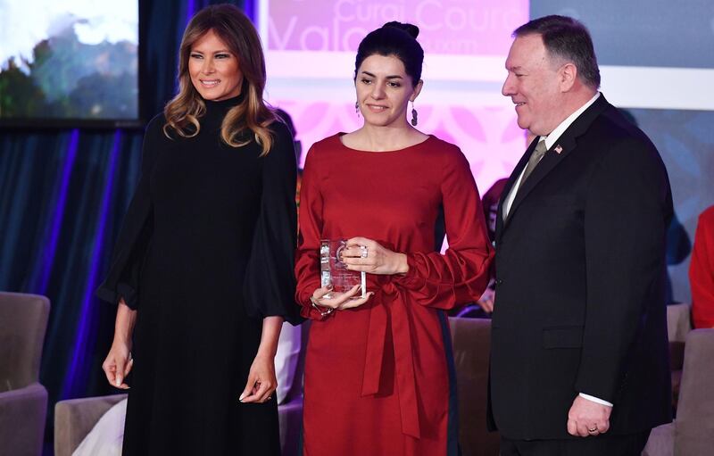 International Women of Courage Award recipient Lucy Kocharyan of Armenia poses with US Secretary of State Mike Pompeo and First Lady Melania Trump.  AFP