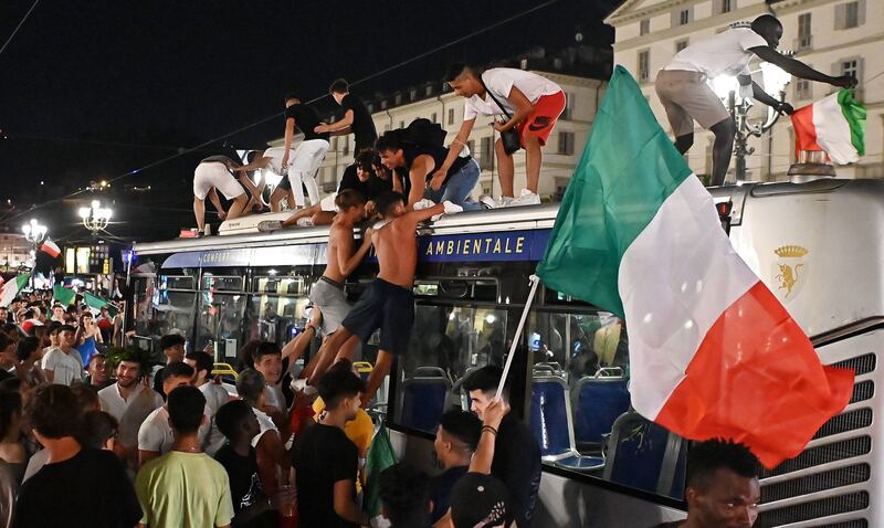 Italy fans celebrate in Turin.