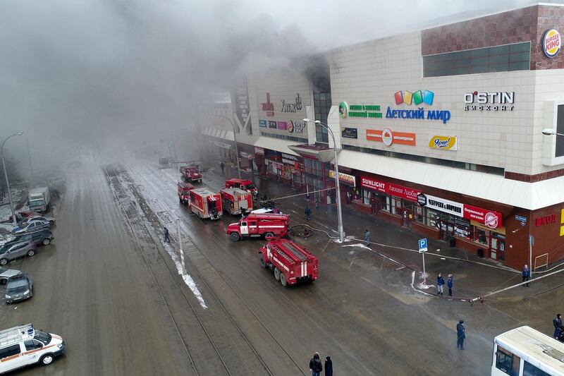 Smoke rises above a multi-story shopping centre in the Siberian city of Kemerovo. Russian Ministry for Emergency Situations photo via AP