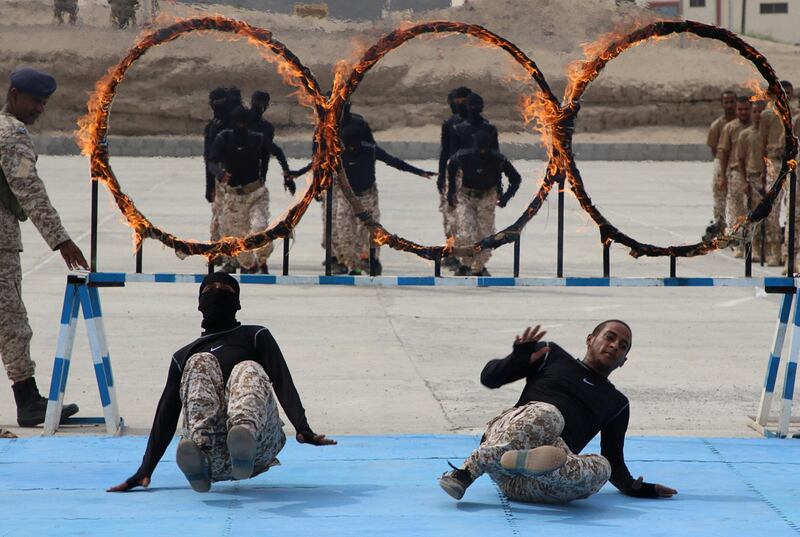Newly recruited troops of the separatist Southern Transitional Council demonstrate their skills during their graduation in Aden, Yemen. Reuters