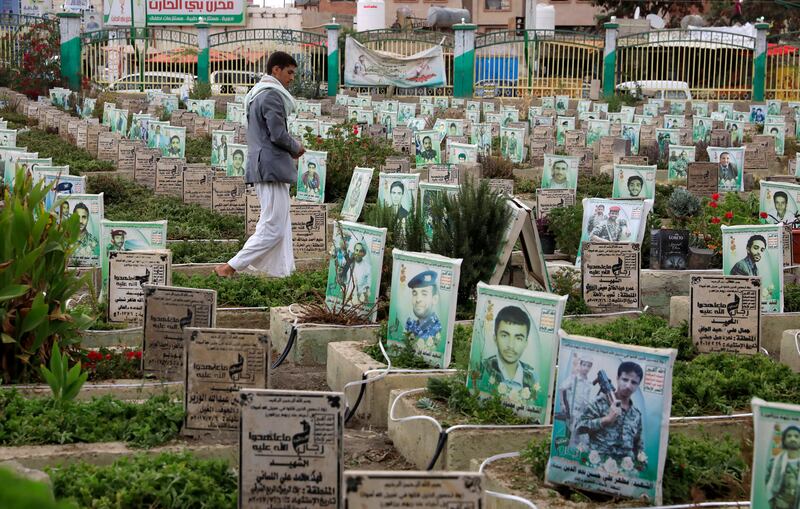 A man walks through a Sanaa cemetery for people killed in Yemen's war. EPA