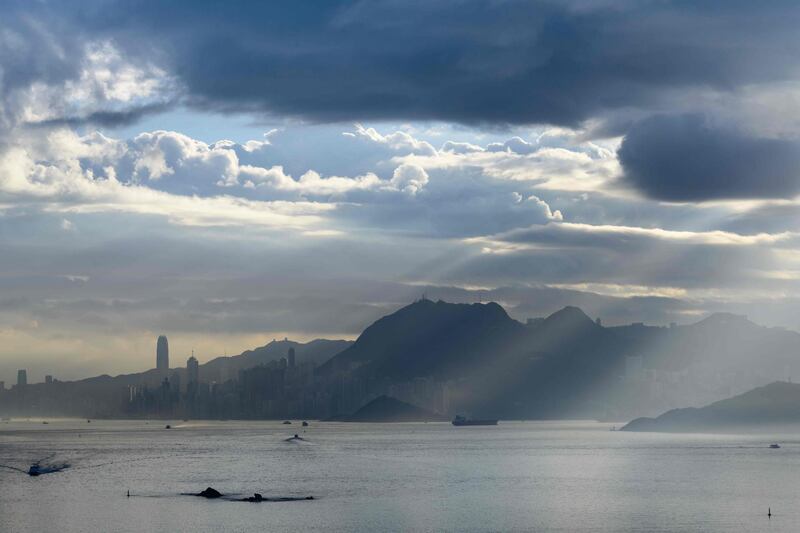Commercial ships and commuter ferries power through the surrounding waters of Hong Kong island. AFP