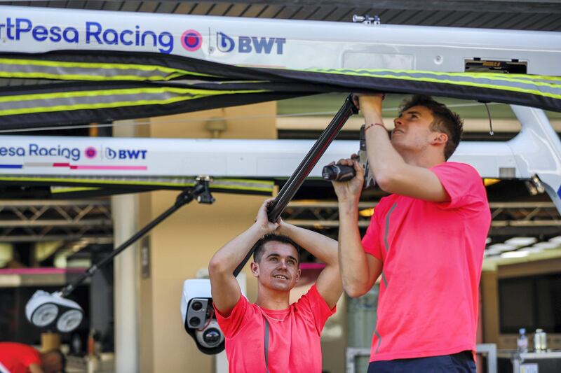 Abu Dhabi, United Arab Emirates, November 26, 2019.  
  Abu Dhabi grand Prix  preparations 2019.
-- Pit stop technicians assemble a hoist in preparations for race day.
Victor Besa / The National
Section:  SP
Reporter:  Simon Wilgress-Pike