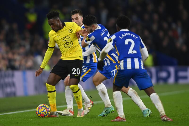Callum Hudson-Odoi of Chelsea is pressured by Steven Alzate and Tariq Lamptey of Brighton. Getty Images